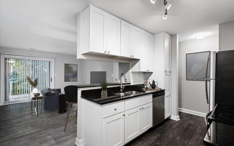 a kitchen with white cabinets