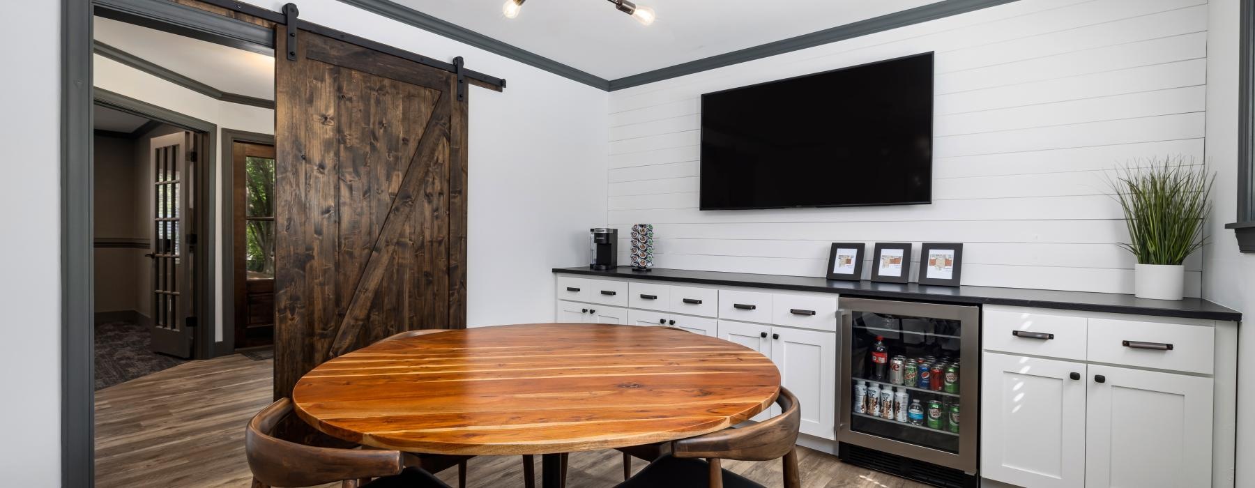 a kitchen with a table and chairs