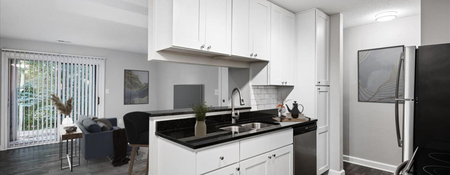 a kitchen with white cabinets